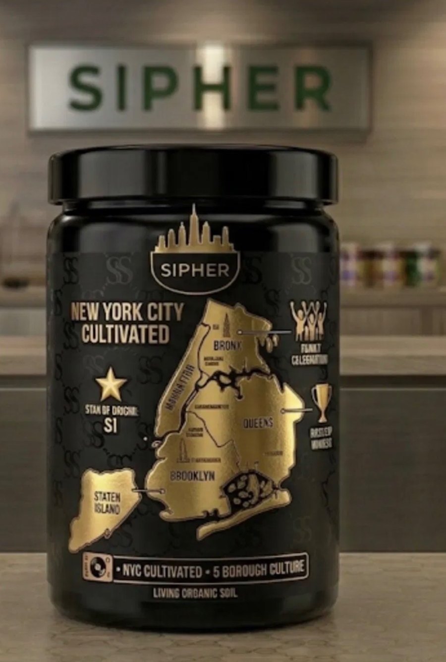 The Sipher jar on a shelf, with a gold five-borough map