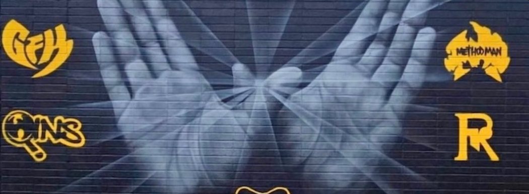 Staten Island mural of two open hands surrounded by gold borough logos